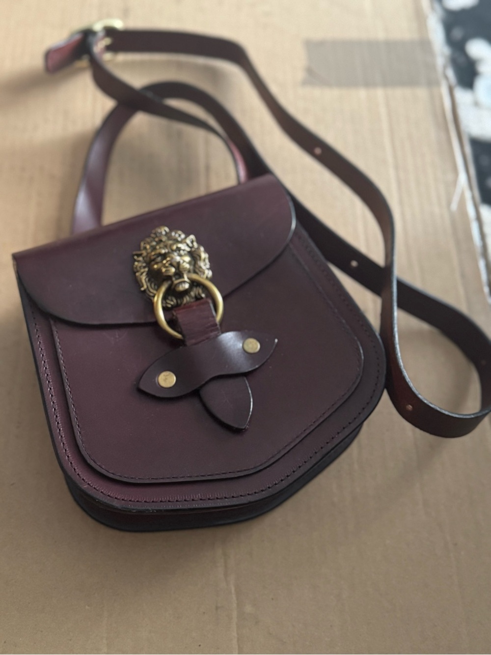Women's Burgundy Leather Crossbody Bag with Lion Ring Accent